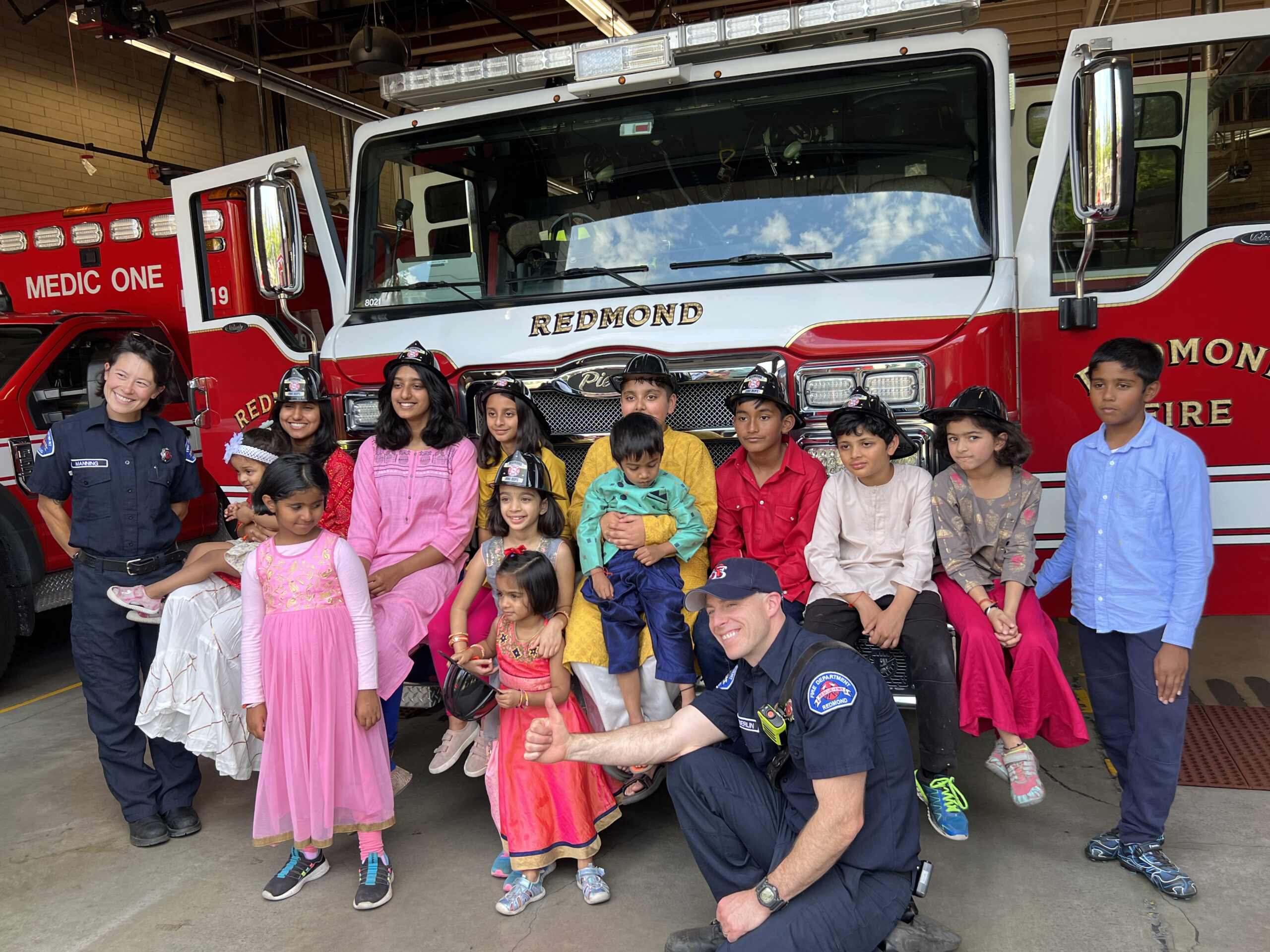 HSS members celebrating Raksha Bandhan with Redmond Fire Department. Photo by Ritu Jain