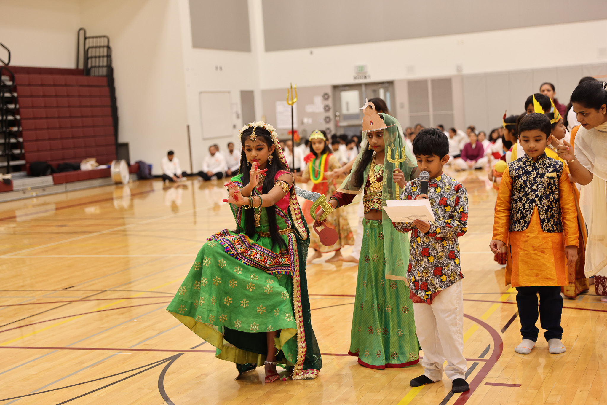 A girl (left) posing as one of the deities of the Navadurga and the boy (right) explaining the associated qualities and mythology. Photo by Pearls of Memories